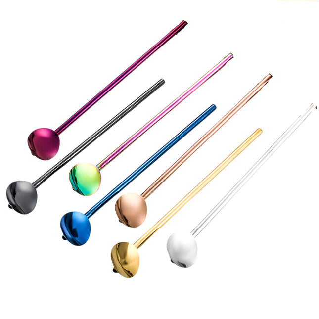 Set of colorful metal ladles on a white background