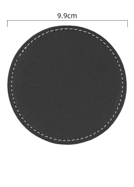 Black round coaster with measurements on a white background