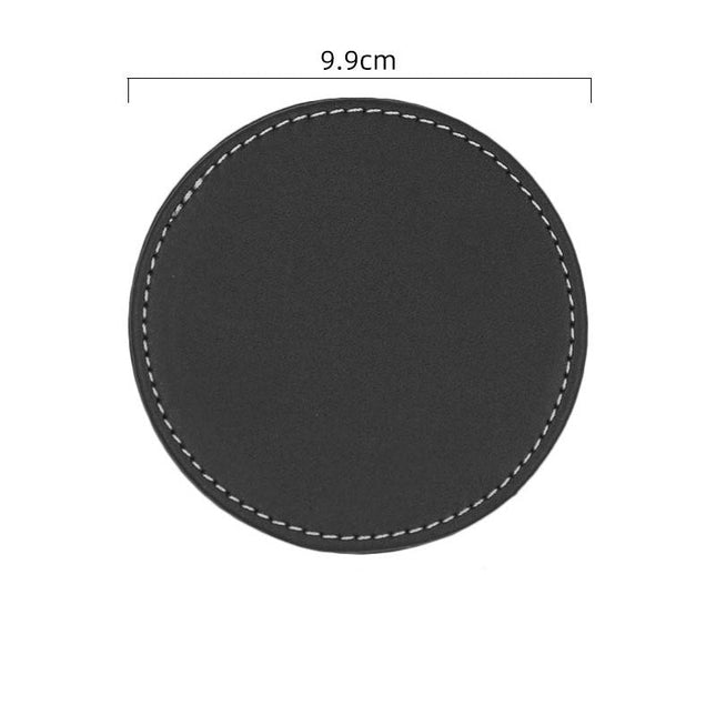 Black round coaster with measurements on a white background