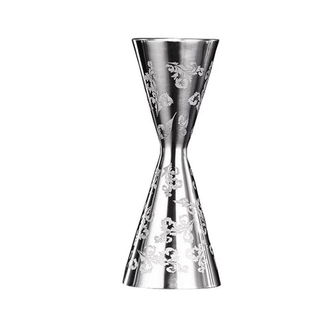 A stainless steel jigger with floral engravings on the side, featuring a narrow waist and additional notches for measurement | Cocktail Ceremony