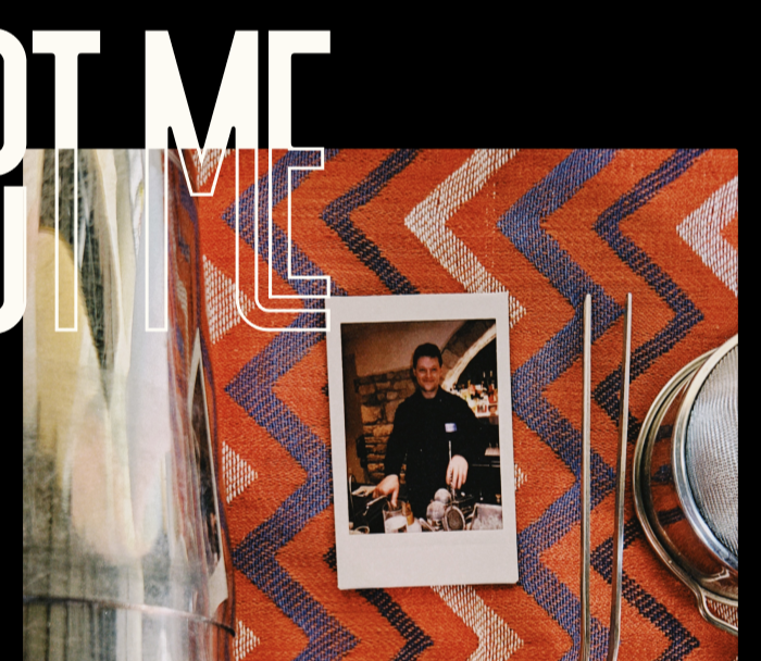 Table setting with cutlery and a photo on a red and blue zigzag patterned tablecloth, with 'ABOUT ME' text overlay.