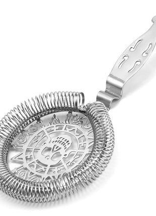 Silver cocktail strainer with intricate design on a white background