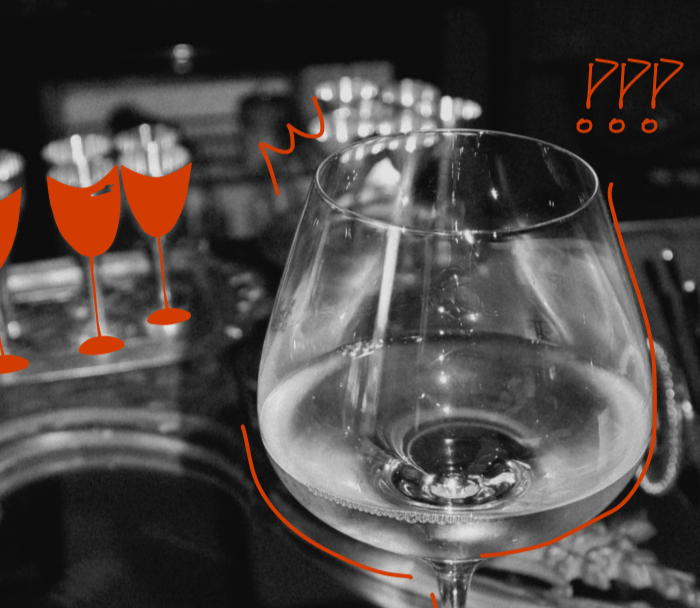 Wine glass with red wine selection on a bar counter