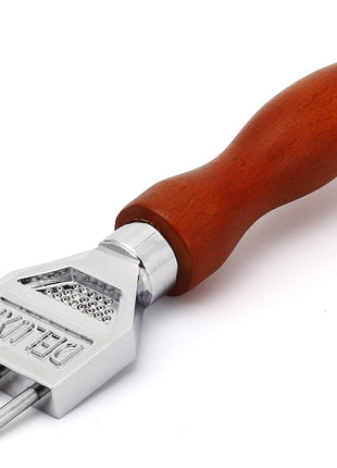 Metal prong tool with wooden handle on a white background