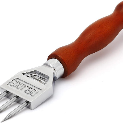 Metal prong tool with wooden handle on a white background