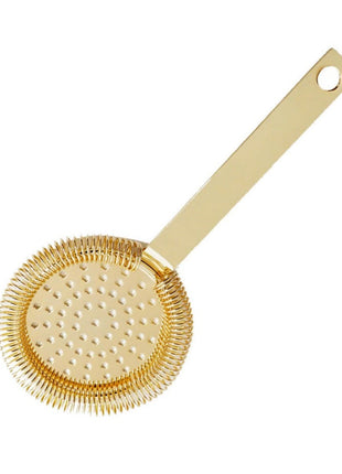 A gold-colored stainless steel Hawthorne strainer with a perforated circular head and a handle.