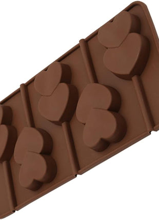 Brown silicone mold with heart shapes on a white background