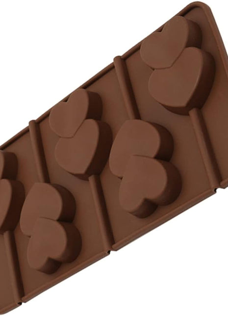 Brown silicone mold with heart shapes on a white background