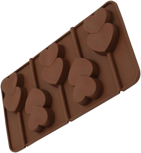 Brown silicone mold with heart shapes on a white background | Cocktail Ceremony