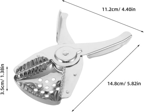Wedge citrus squeezer — squeezing a citrus wedge over a glass | Cocktail Ceremony