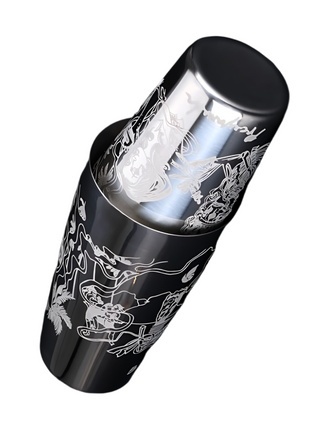 Metallic cylindrical object with engraved designs on a black background