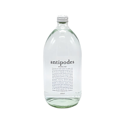 Clear glass bottle with a label on a white background
