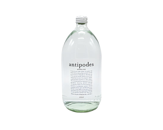 Clear glass bottle with a label on a white background