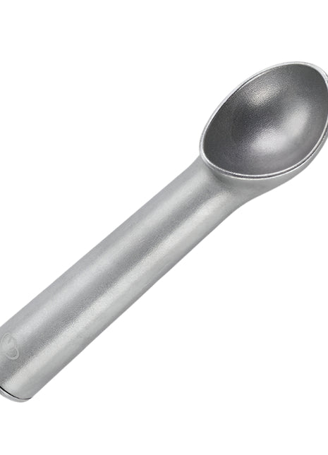 Metallic ice cream scoop on a light gray background