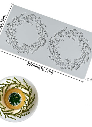 Silicone mold with leaf pattern and a sample of a dish it has created.