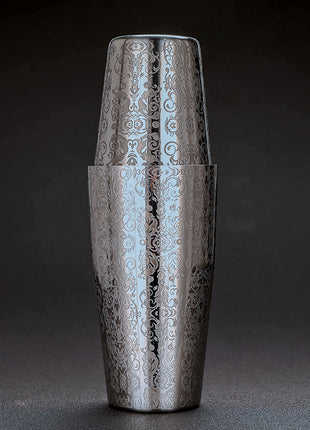 Silver embossed cocktail shaker on a dark background