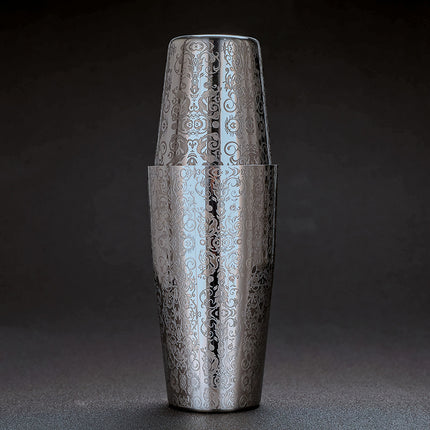 Silver embossed cocktail shaker on a dark background