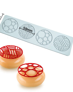 Mold with geometric patterns and two molded products on a white background