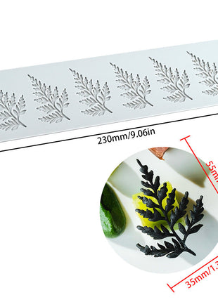 Silicone mold with leaf patterns and dimensions on a white background