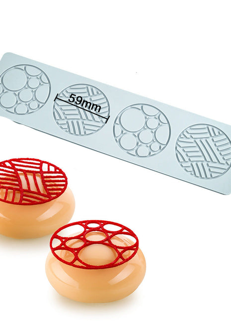 Mold with geometric patterns and two molded products on a white background