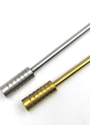Two metal rods, one gold and one silver, on a white background