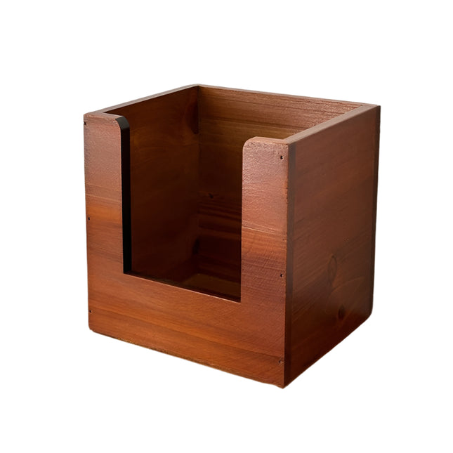 Wooden pen holder with dimensions on a wooden surface