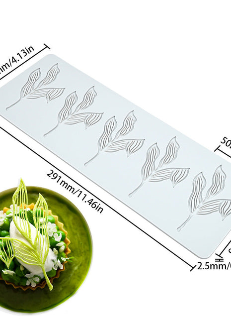 Silicone mold with leaf design and dimensions displayed, used for baking.