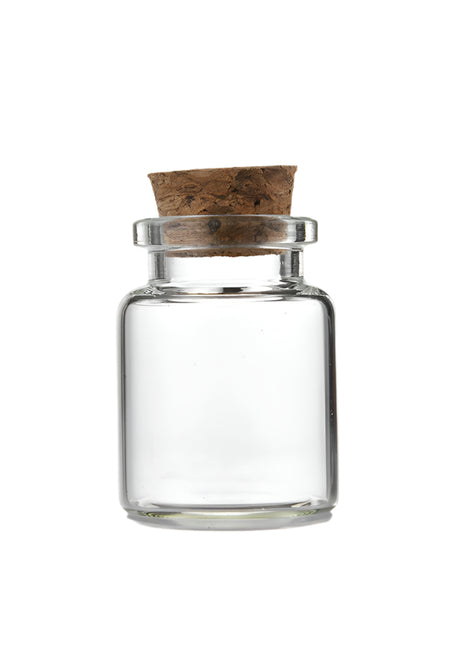 Small clear glass jar with cork lid and measurements on a white background