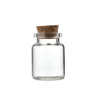 Small clear glass jar with cork lid and measurements on a white background | Cocktail Ceremony