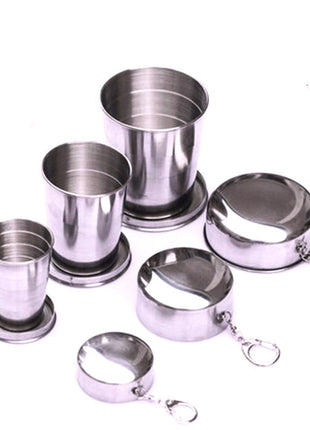 Set of stainless steel cups and strainers with a '304' stamp on a white background