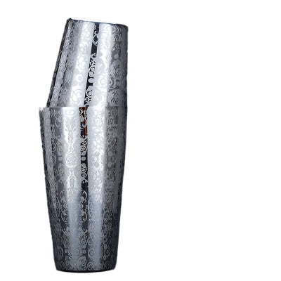 Two silver cocktail shakers with intricate patterns on a black background, featuring text details.