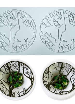 Silicone mold with deer and tree design on a light blue background