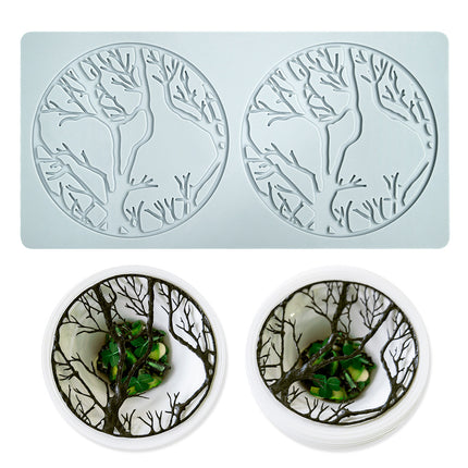 Silicone mold with deer and tree design on a light blue background
