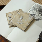 Fabric Coaster — Beige base with cranes (9×9 cm)