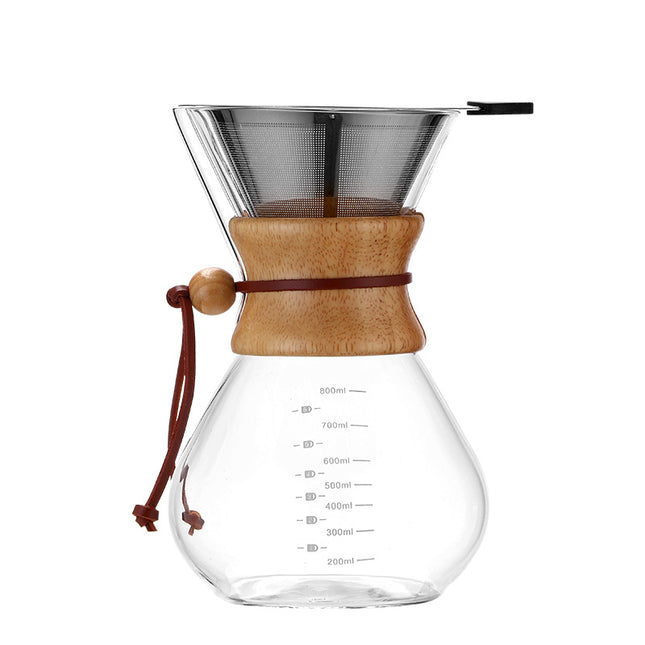 Clear glass coffee maker with wooden collar and metal filter on a white background