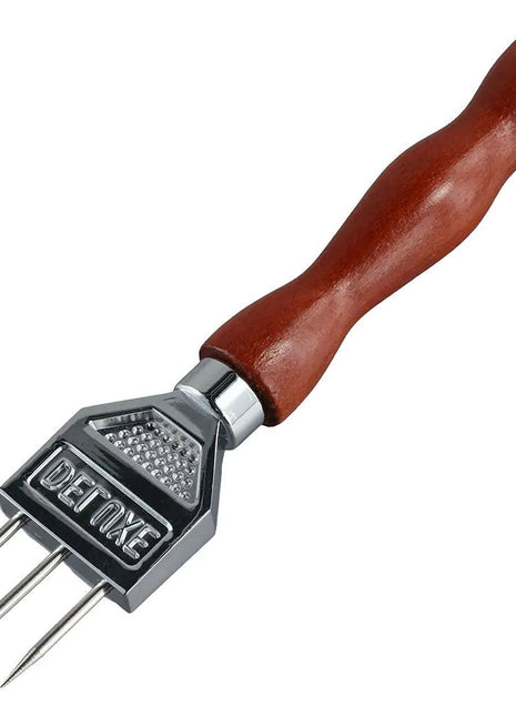 Barbecue skewer with wooden handle and metal prongs on a white background