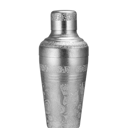 Decorative silver cocktail shaker on a white background with a brand logo at the top.