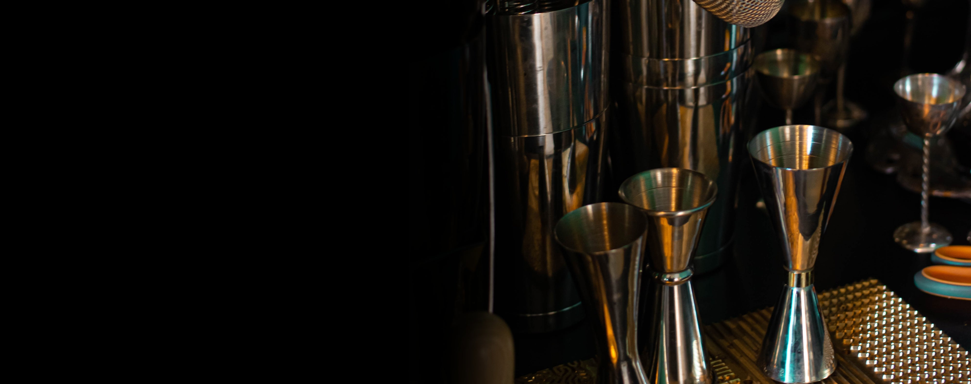 professional bartenders equipment, bar tools: shakers, strainers , jiggers , spoons and glasses.