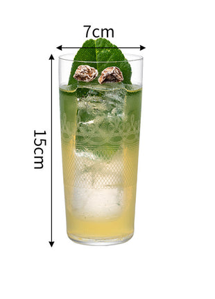 Glass of green drink with ice and mint leaves, dimensions indicated on a white background