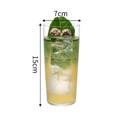 Glass of green drink with ice and mint leaves, dimensions indicated on a white background