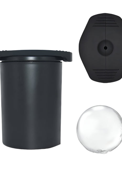 Black cylindrical container with lid, clear sphere, and black circular component on a white background
